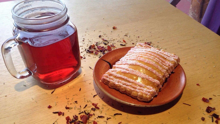 Tea and a raspberry pop pie.