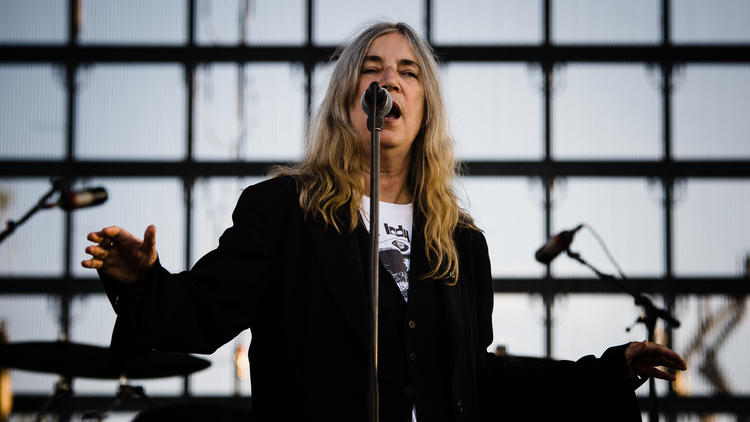 Attendees enjoy a punk rock carnival and watch Patti Smith during the final day of Riot Fest Chicago on September 14, 2014.