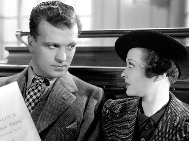 Best British Movies: Sabotage (1936) A still from black and white film Sabotage of a man and woman looking intently at each other