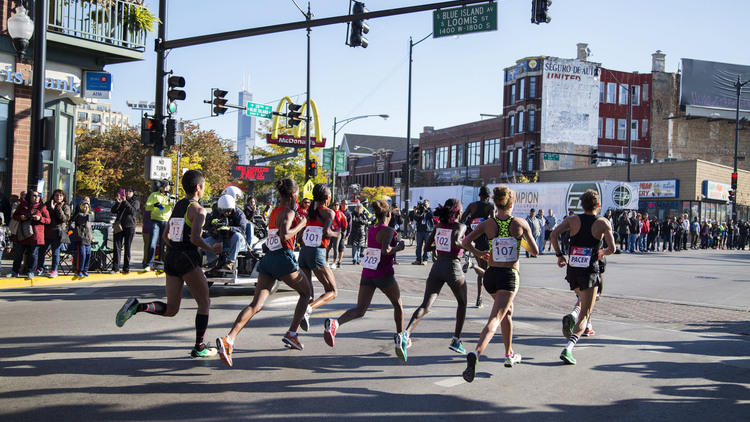 45,000 runners hit the streets of Chicago, winding through 29 neighborhoods during the Chicago Marathon on October 12, 2014.