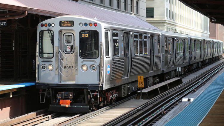 A CTA train pulls into the Quincy station.