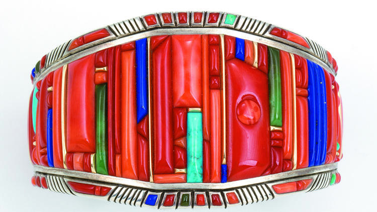 Raymond C. Yazzie. 2005. Silver inlaid with coral, turquoise, lapis lazuli, 14 karat gold accents. 23⁄8 x 1 inch. Collection of Mark and Martha Alexander.