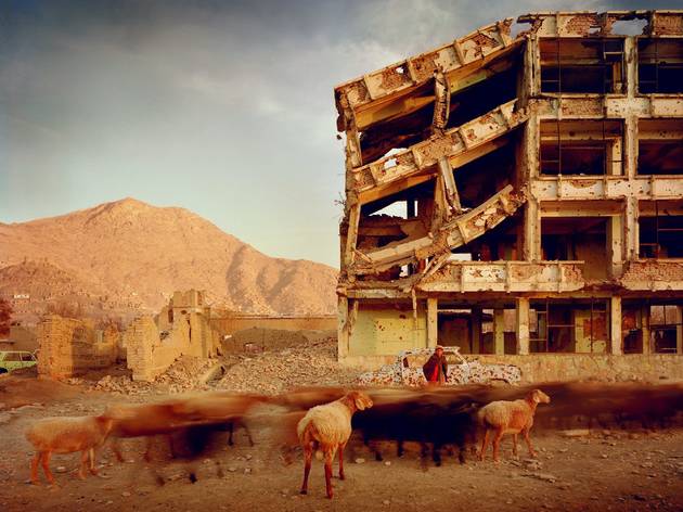 Simon Norfolk Simon Norfolk (Bullet-scarred apartment building and shops in the Karte Char district of Kabul. This area saw fighting between Hikmetyar and Rabbani and then between Rabbani and the Hazaras 2003)