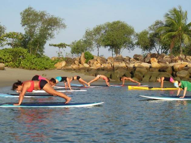 Paddle around on a surfboard Paddle around on a surfboard