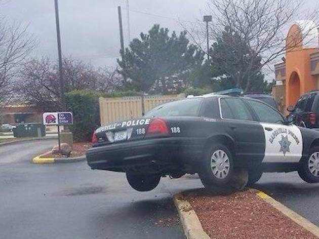 Police car stuck on a boulder at Taco Bell Police car stuck on a boulder at Taco Bell