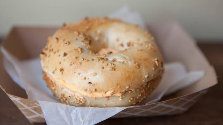 Garlic bagel with sriracha spread at Brobagel