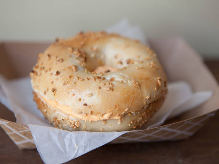 Garlic bagel with sriracha spread at Brobagel