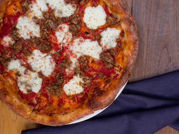 Housemade pork sausage pizza at Stella Barra Pizzeria Housemade pork sausage pizza at Stella Barra Pizzeria