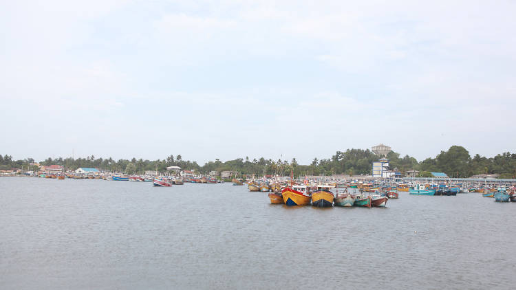 Colourful fishing boats complete the beach landscape