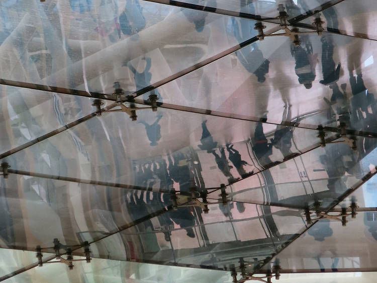 Shoppers reflected in the Bullring ceiling