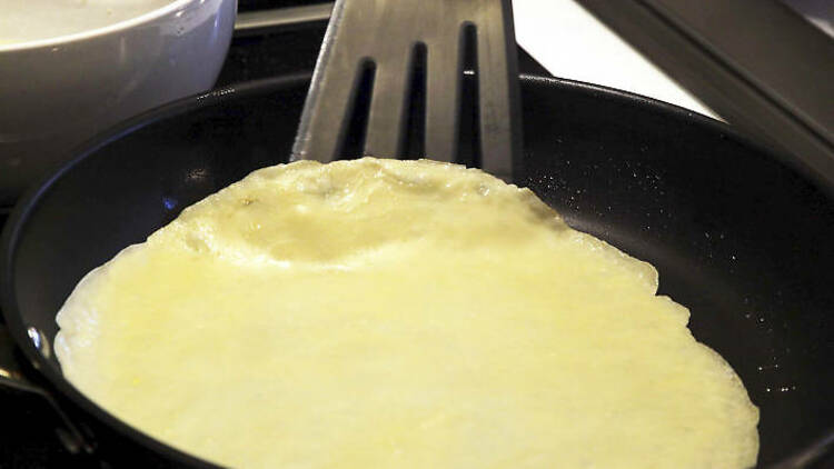 9. Check the first side is cooked and then flip the pancake over