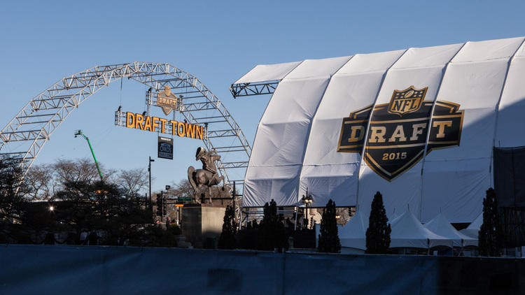 Football fans show off their team spirit in Grant Park at NFL Draft Town, April 30, 2015.