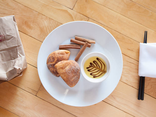 Oiistar serves a bao doughnut.