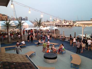 You can watch movies on the beach at this waterfront bar starting tomorrow