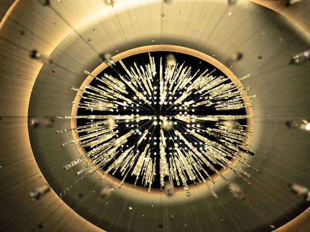Looking up at the chandelier in Rockefeller Center Chaos Theory