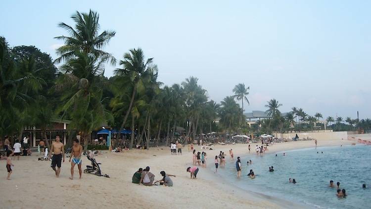 Build sandcastles at Siloso Beach