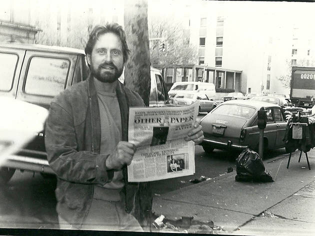 Michael Douglas holding The Other Paper, 1980