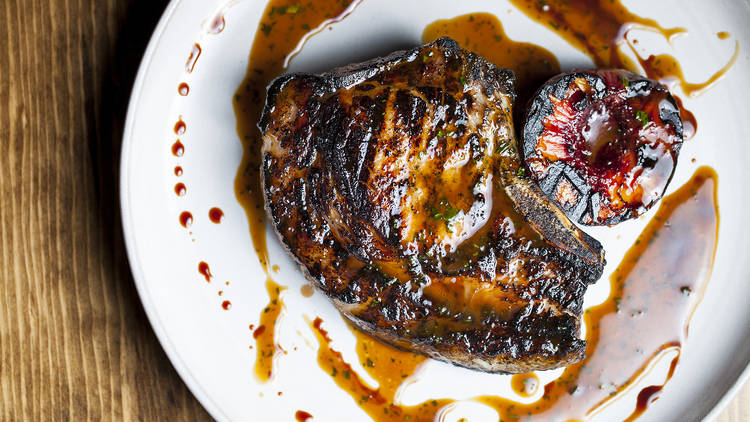 Wood grilled pead & barnett pork chop with fig and brown butter