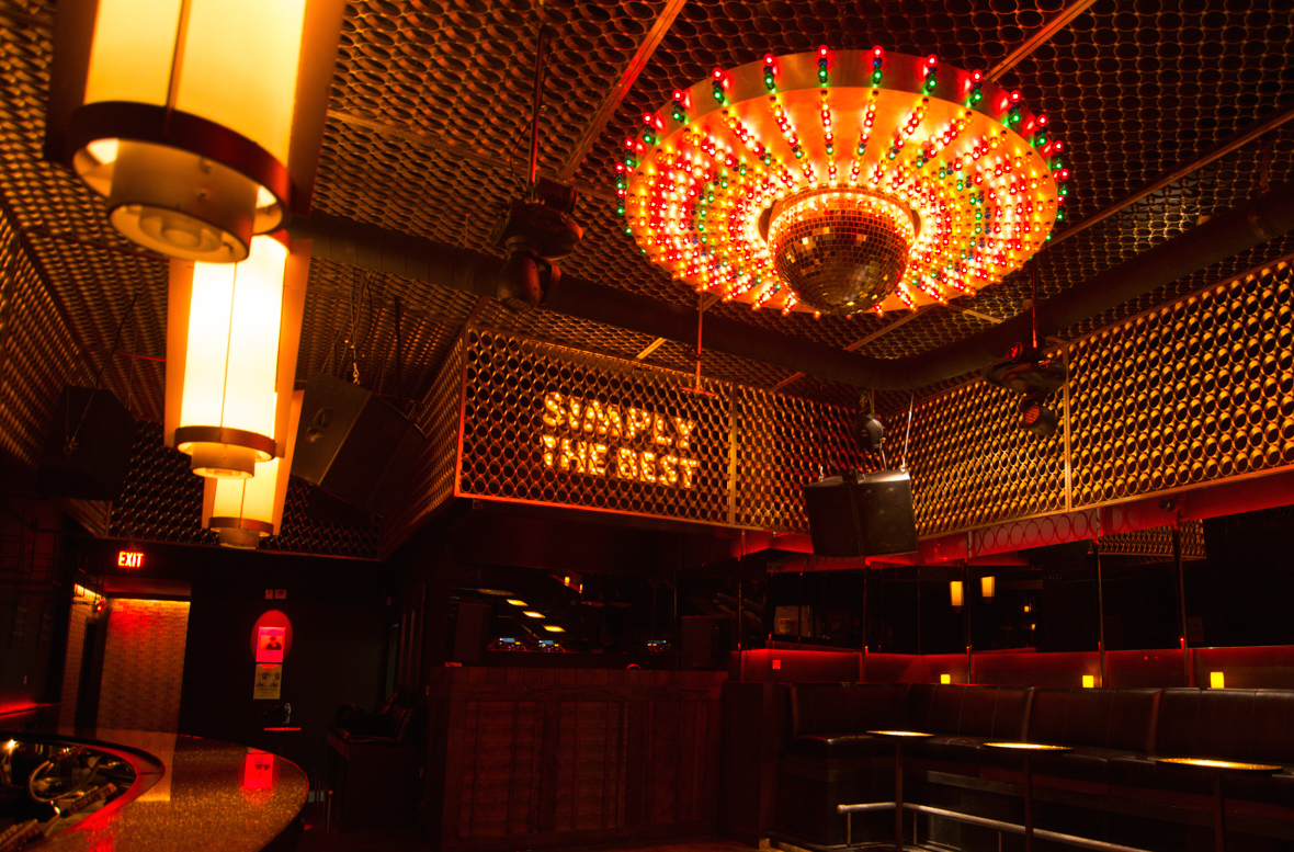 Night club Bar counter. Dance club's neon-lit interior. Modern