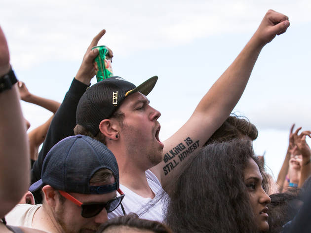 Soggy weather didn't dissuade attendees from showing up to the first day of Riot Fest, September 11, 2015.