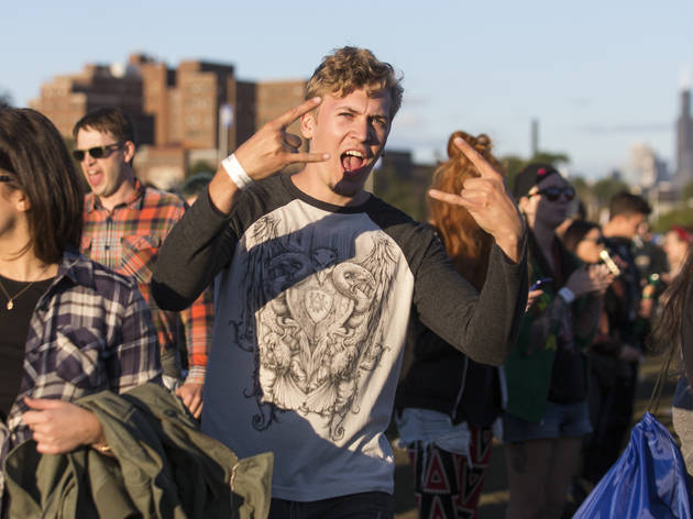 Crowds trudged through muddy fields during the second day of Riot Fest, September 12, 2015.