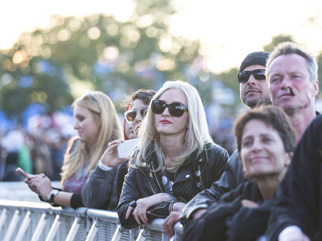 Crowds trudged through muddy fields during the second day of Riot Fest, September 12, 2015.