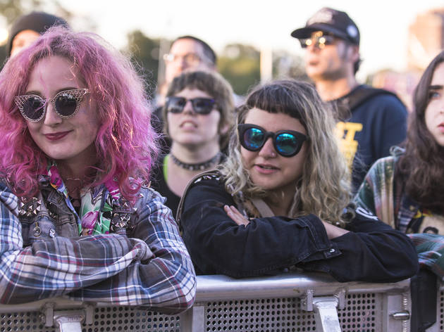 Crowds trudged through muddy fields during the second day of Riot Fest, September 12, 2015.