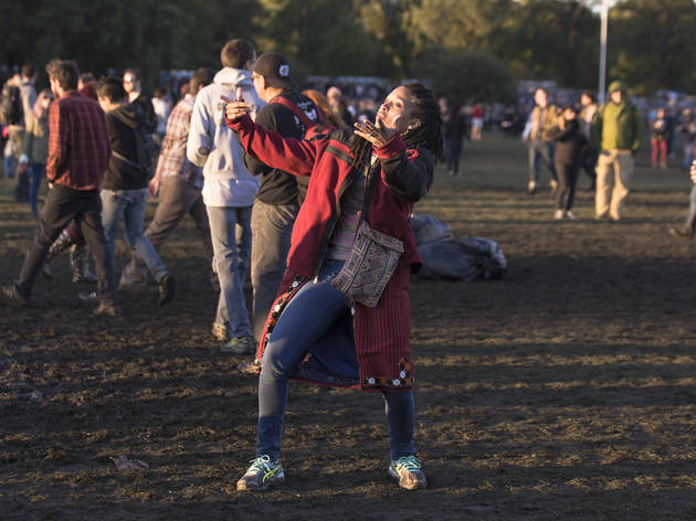 Crowds trudged through muddy fields during the second day of Riot Fest, September 12, 2015.