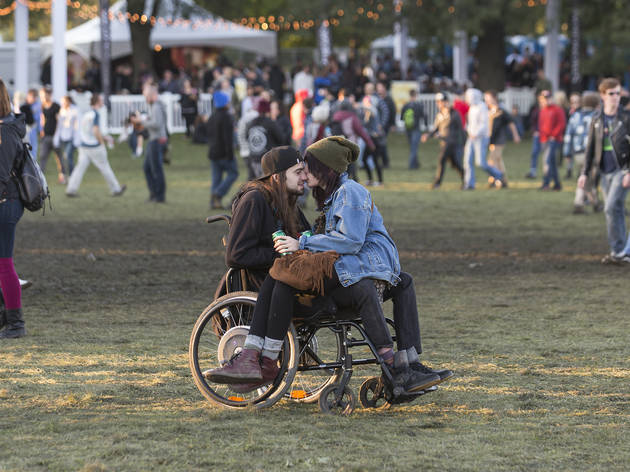Crowds trudged through muddy fields during the second day of Riot Fest, September 12, 2015.