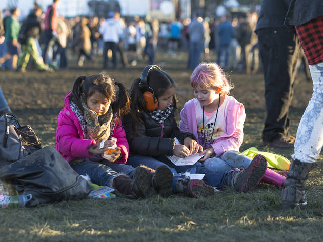 Crowds trudged through muddy fields during the second day of Riot Fest, September 12, 2015.