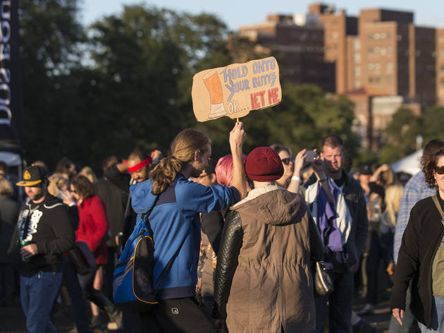 Crowds trudged through muddy fields during the second day of Riot Fest, September 12, 2015.