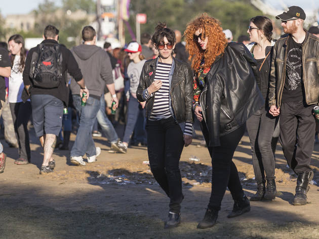 Crowds trudged through muddy fields during the second day of Riot Fest, September 12, 2015.