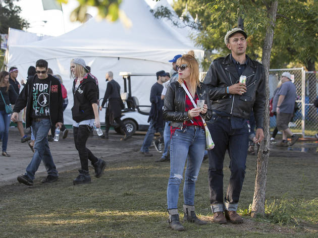 Crowds trudged through muddy fields during the second day of Riot Fest, September 12, 2015.