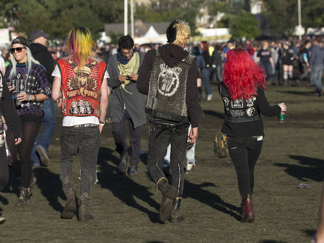 Crowds trudged through muddy fields during the second day of Riot Fest, September 12, 2015.