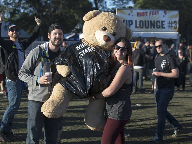 Crowds trudged through muddy fields during the second day of Riot Fest, September 12, 2015.