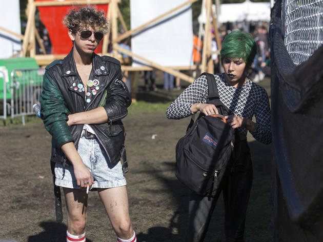Crowds trudged through muddy fields during the second day of Riot Fest, September 12, 2015.