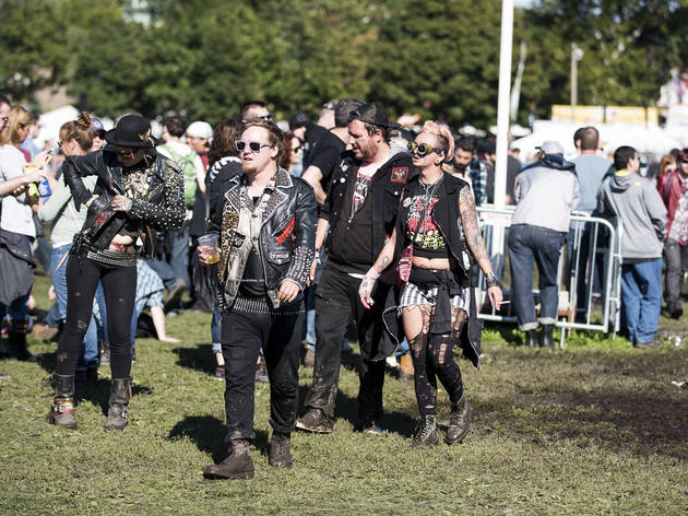 Crowds trudged through muddy fields during the second day of Riot Fest, September 12, 2015.