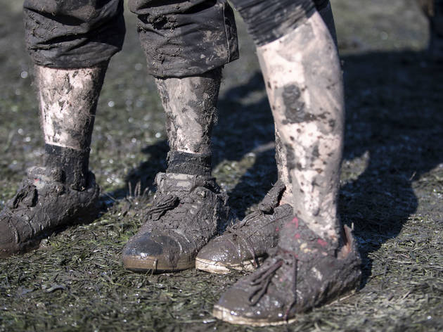 Crowds trudged through muddy fields during the second day of Riot Fest, September 12, 2015.