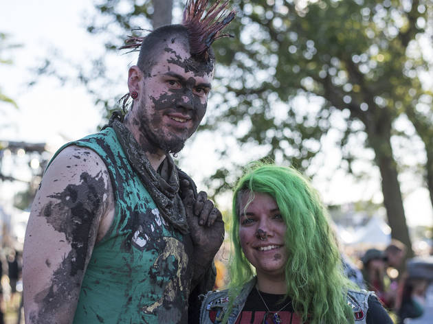 Crowds trudged through muddy fields during the second day of Riot Fest, September 12, 2015.