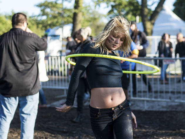 Crowds trudged through muddy fields during the second day of Riot Fest, September 12, 2015.