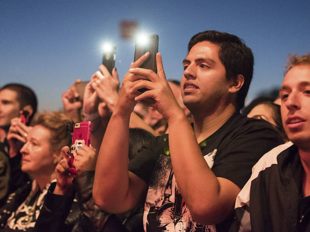 Crowds trudged through muddy fields during the second day of Riot Fest, September 12, 2015.