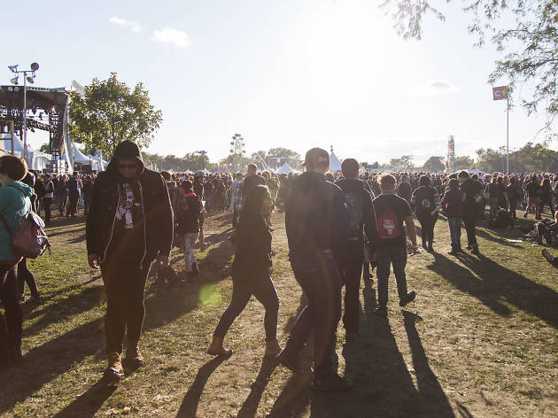 Crowds trudged through muddy fields during the second day of Riot Fest, September 12, 2015.