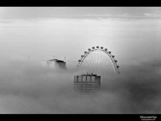 The London Eye, as seen on a foggy day. The London Eye, as seen on a foggy day.