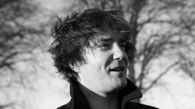 A black-and-white profile picture of Irish comedian Dylan Moran