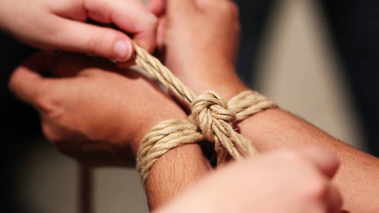 Wrists being bound together with rope at Melbourne Rope Dojo