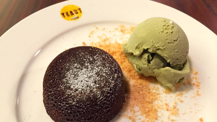 Warm chocolate fondant, almond crumble, pistachio ice cream from Yeast