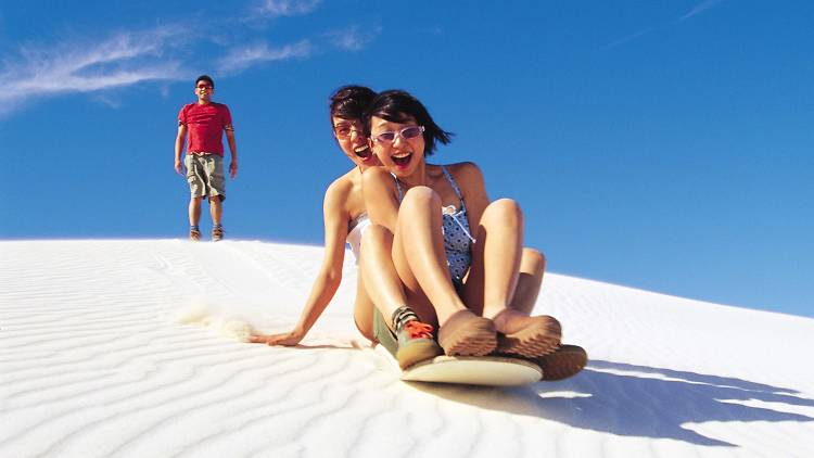 Slide down sand dunes