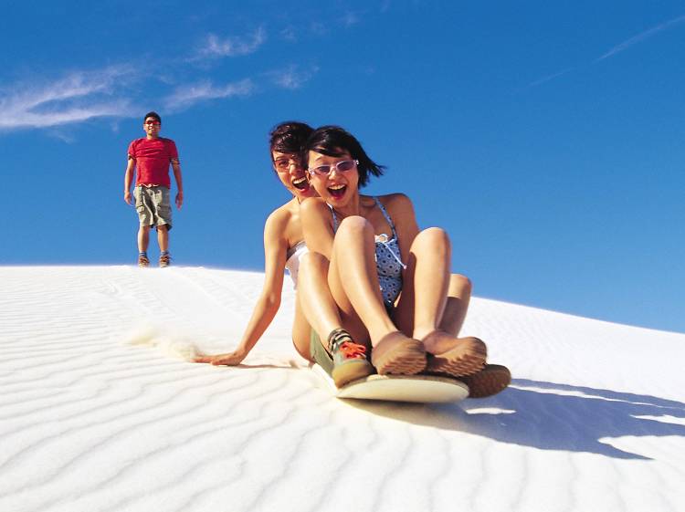 Slide down sand dunes