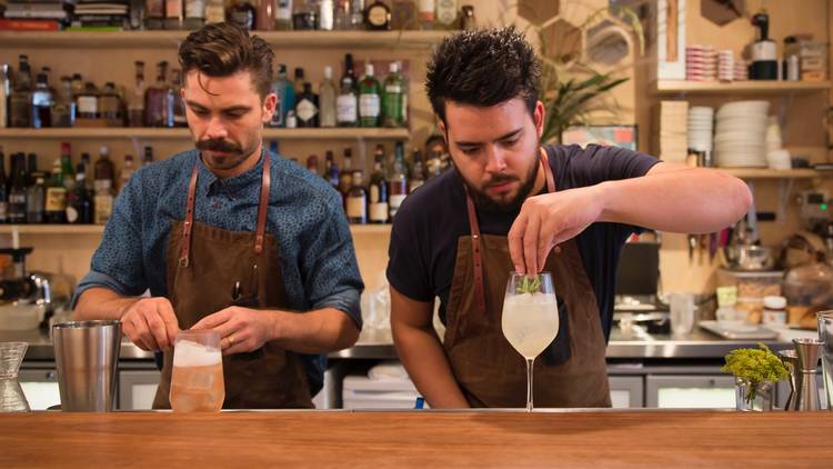 Owners Luke Ashton and Charlie Ainsbury behind the bar making co