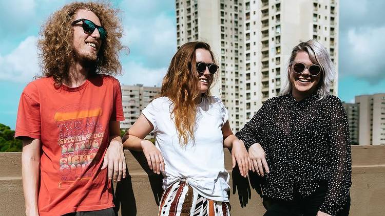 Andy Webb, Adi Toohey and Carly Roberts of Picnic chill on a rooftop